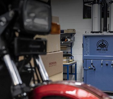 Blue baler in automotive repair shop